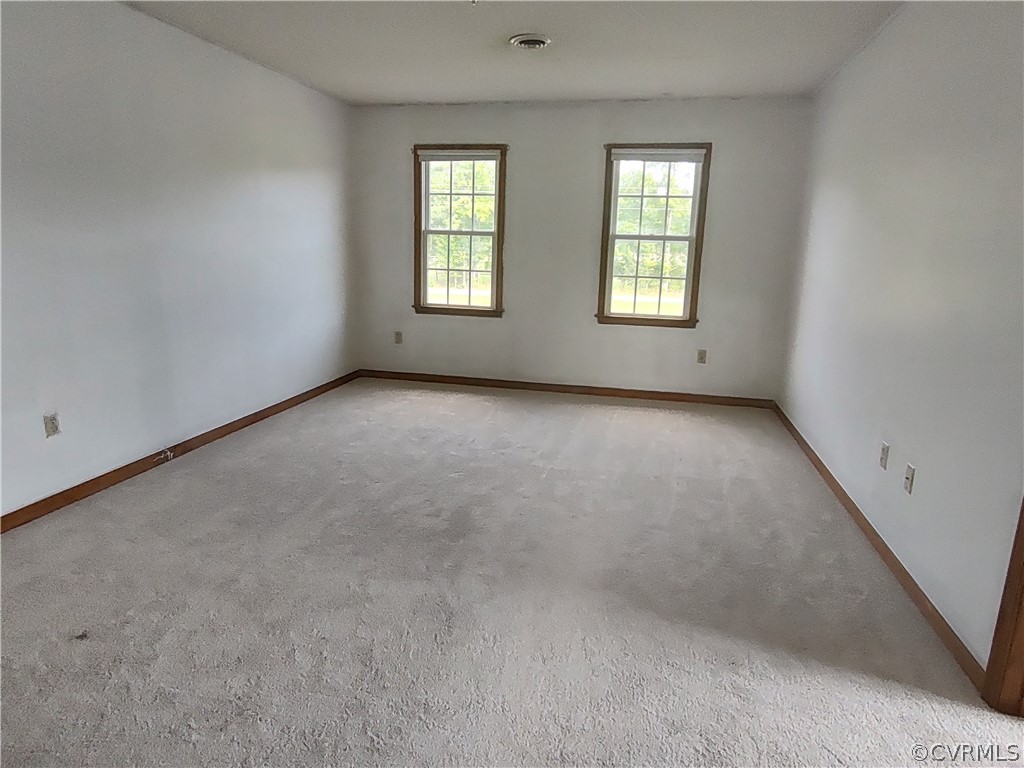 15895 Loving Union Road Disputanta, VA 23842 - Photo 42 of 42 an empty room with windows