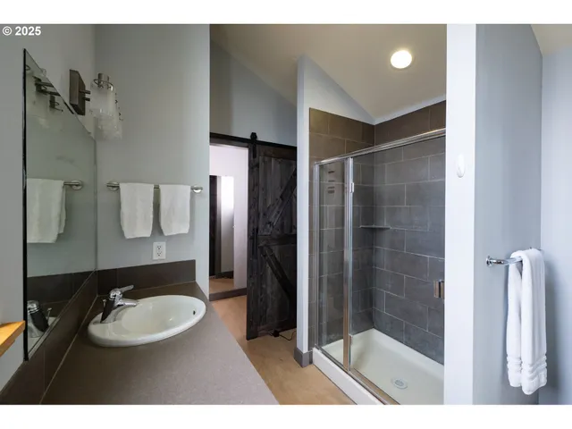 a bedroom with a bed and a night stand