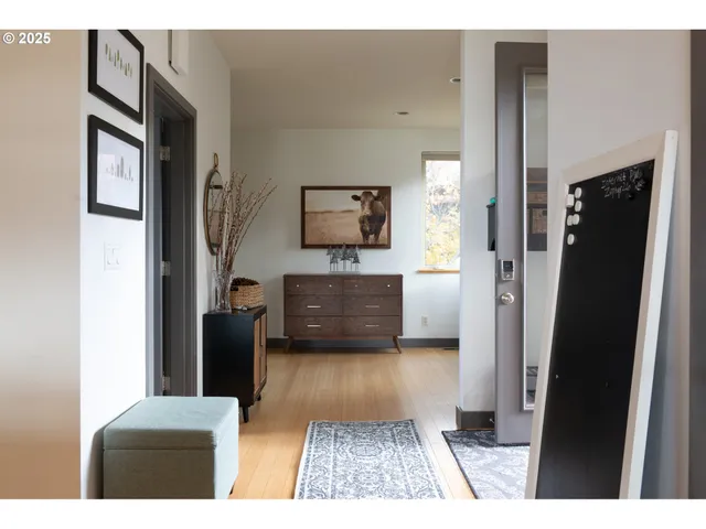 a en suite bathroom with a granite countertop sink and a mirror