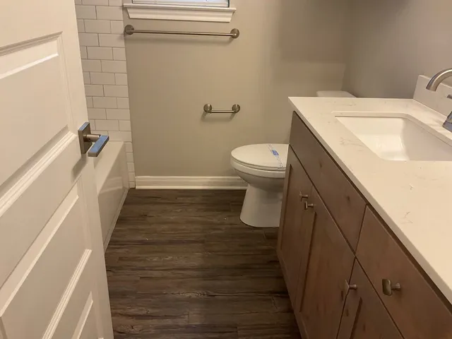 a bathroom with a sink and toilet
