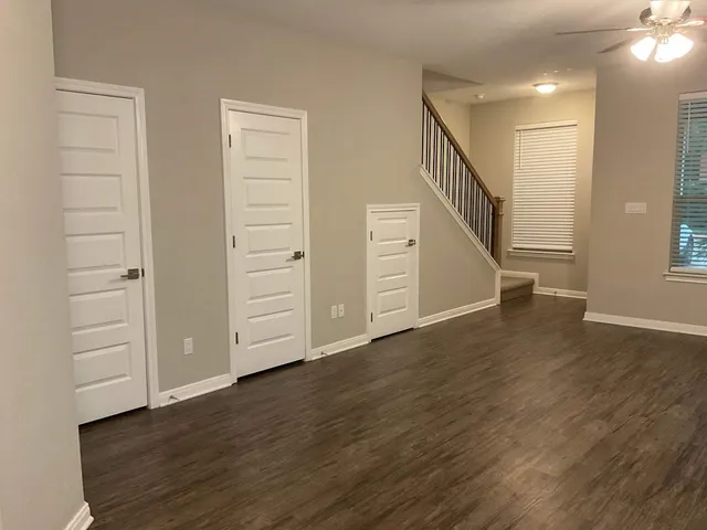 a view of an entryway with wooden floor