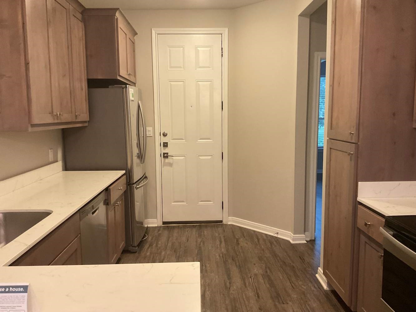 179 Holly Street Georgetown, TX 78626 - Photo 5 of 13 a kitchen with a refrigerator and a stove top oven