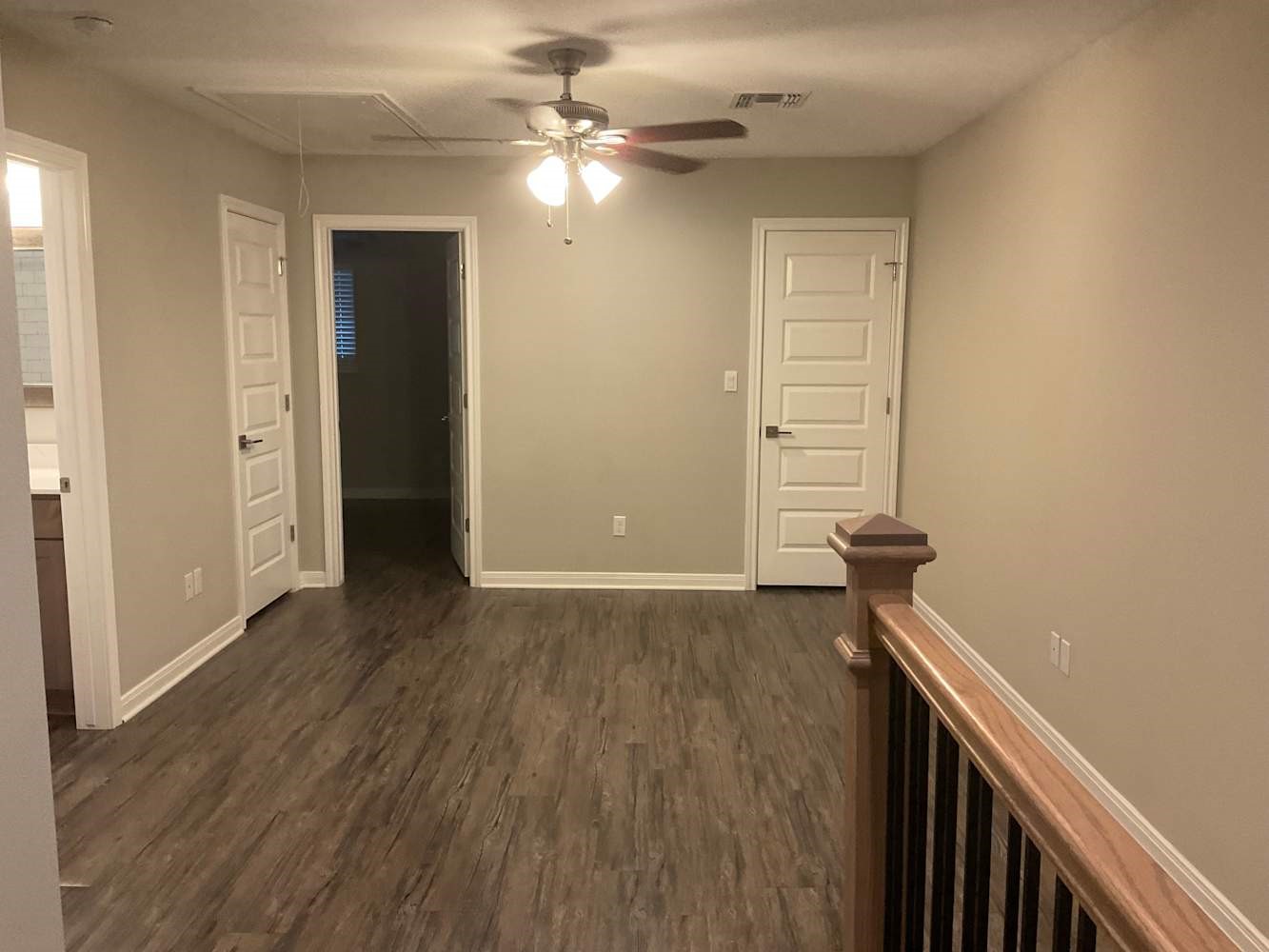 179 Holly Street Georgetown, TX 78626 - Photo 7 of 13 wooden floor in an empty room with a window
