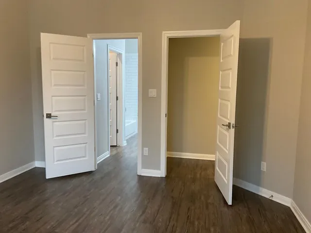 wooden floor with closet area