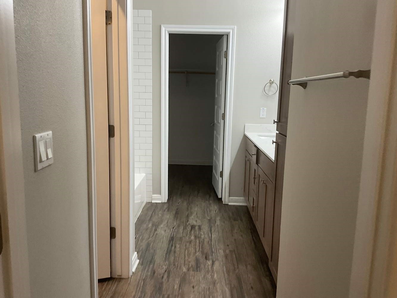 179 Holly Street Georgetown, TX 78626 - Photo 10 of 13 a view of a hallway with wooden floor and a hallway