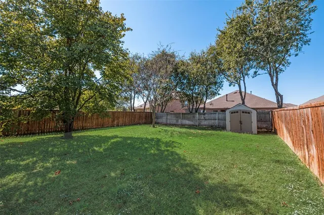 a view of a big yard next to a house