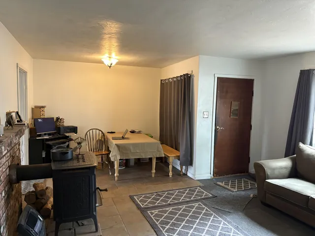 a living room with furniture and a rug