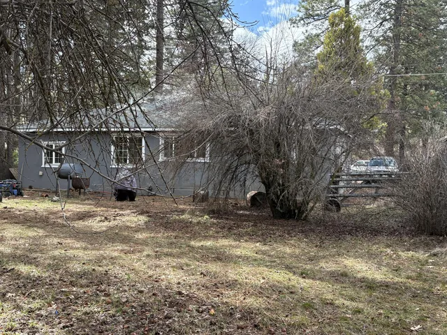 a backyard of a house with lots of green space