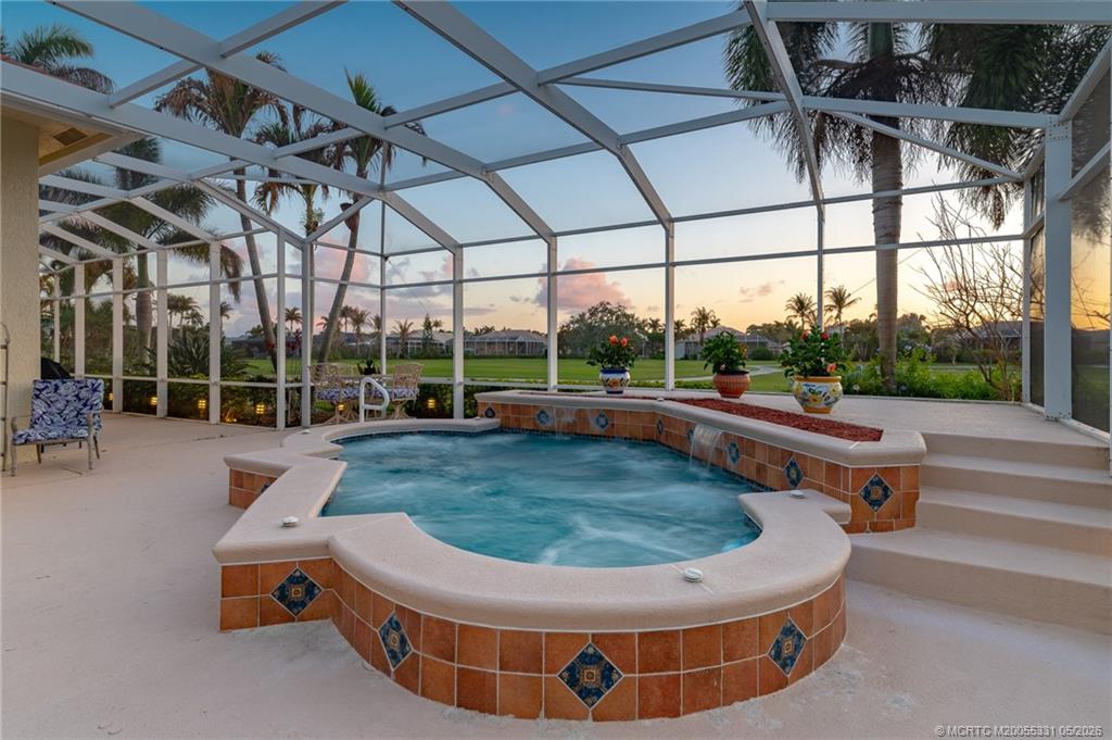 2216 Southeast Stonehaven Road Port St. Lucie, FL 34952 - Photo 42 of 67 a view of a swimming pool with a patio