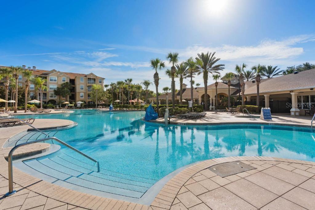 2817 Almaton Loop, Unit 304 Kissimmee, FL 34747 - Photo 17 of 26 a view of a swimming pool with a patio