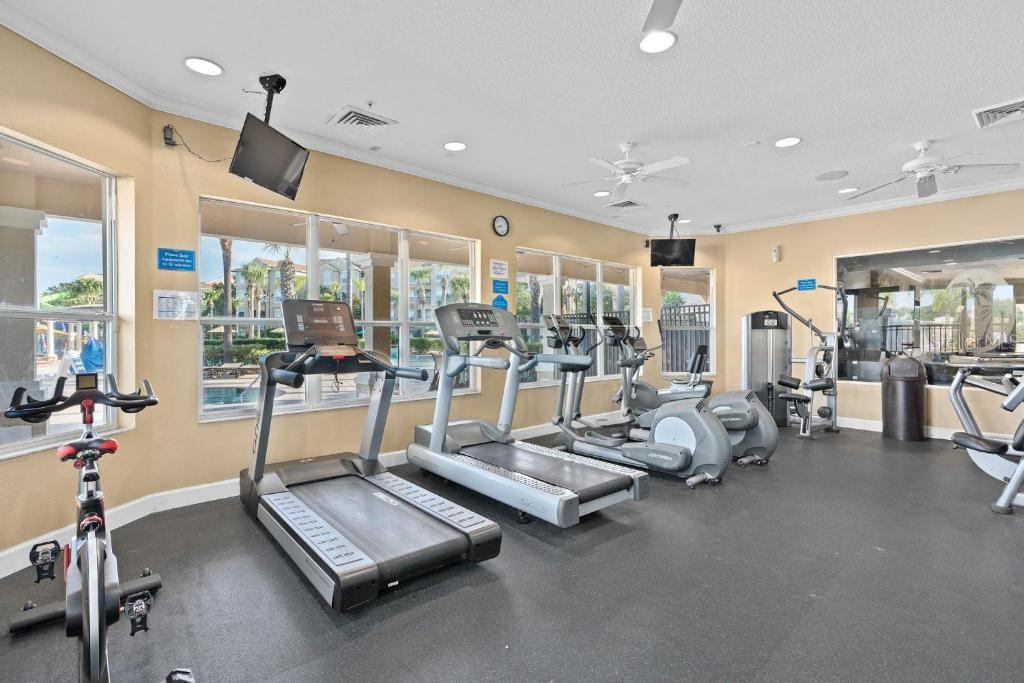 2817 Almaton Loop, Unit 304 Kissimmee, FL 34747 - Photo 22 of 26 a room with gym equipment and large mirror