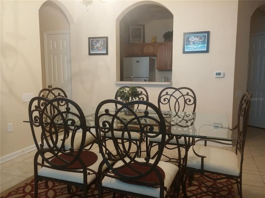 2817 Almaton Loop, Unit 304 Kissimmee, FL 34747 - Photo 10 of 26 a view of a dining room with furniture