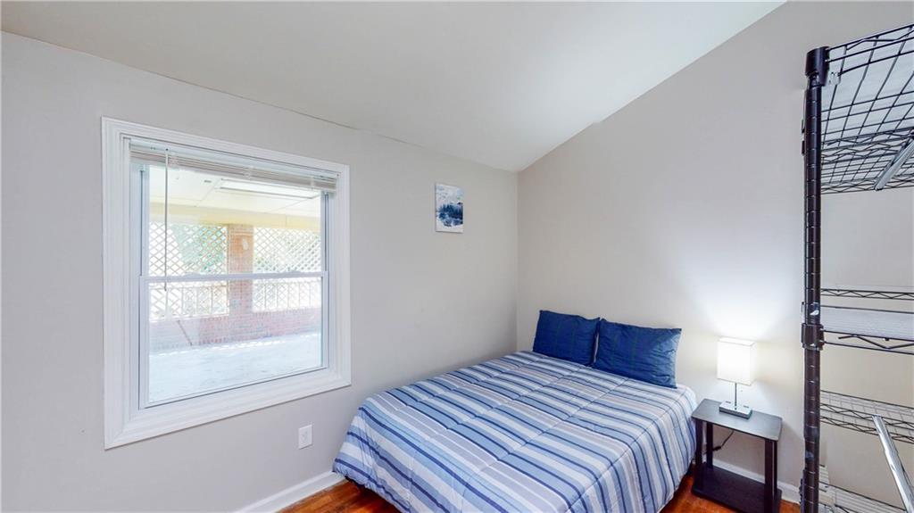 5960 Buffington Road Atlanta, GA 30349 - Photo 2 of 9 a bedroom with a bed and a window