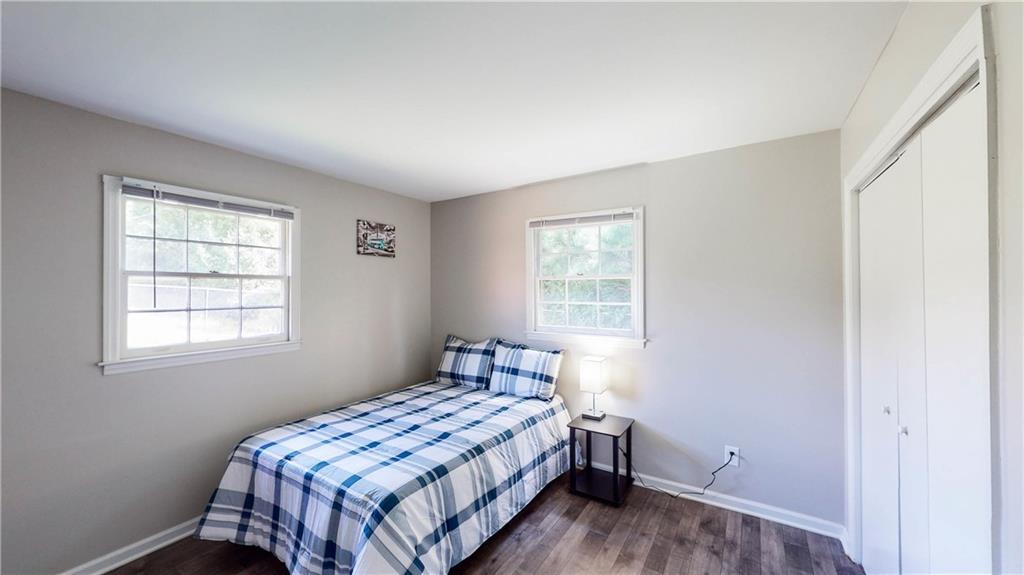 5960 Buffington Road Atlanta, GA 30349 - Photo 6 of 9 a bedroom with a bed and a window