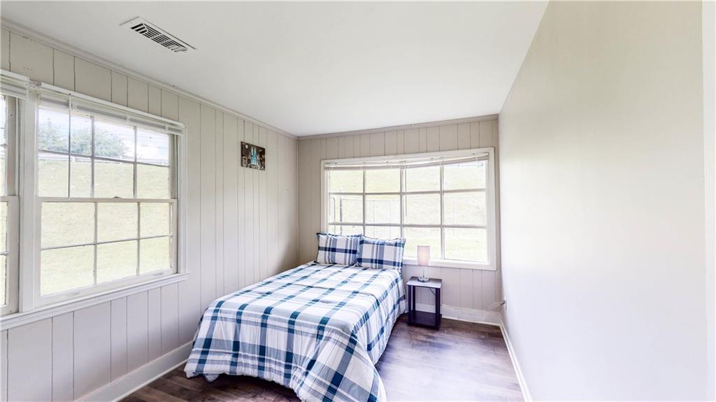 5960 Buffington Road Atlanta, GA 30349 - Photo 8 of 9 a bedroom with a bed and a window