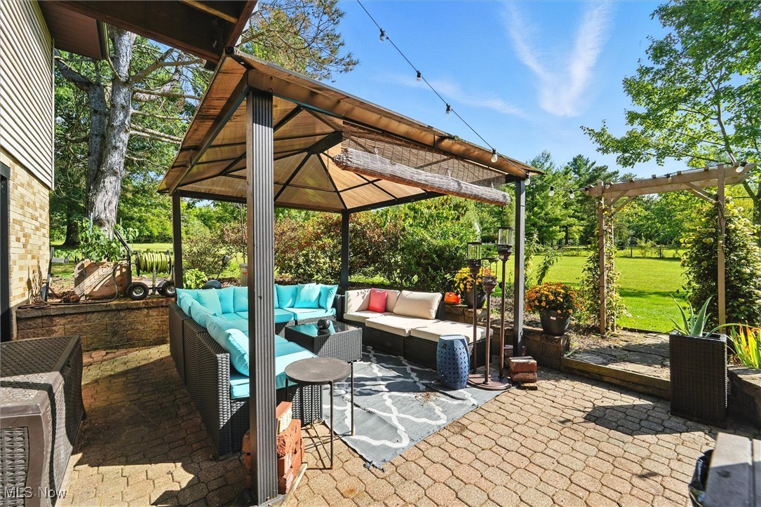 12120 Caves Road Chesterland, OH 44026 - Photo 42 of 50 View of patio with a gazebo and an outdoor living space