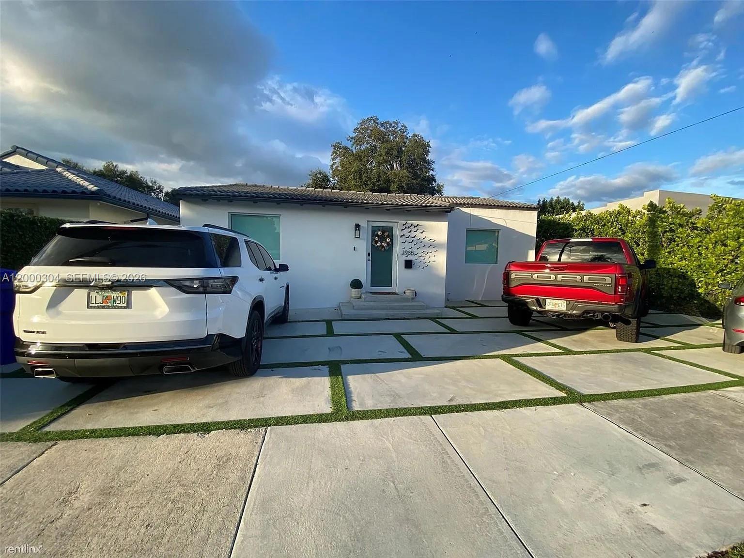 a car parked in front of a house