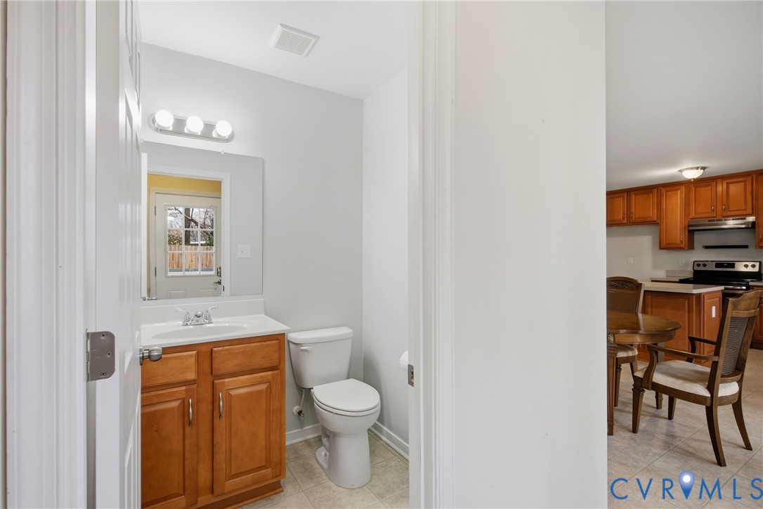 3007 Valleyfield Road Henrico, VA 23228 - Photo 17 of 38 a bathroom with a toilet a sink and a mirror