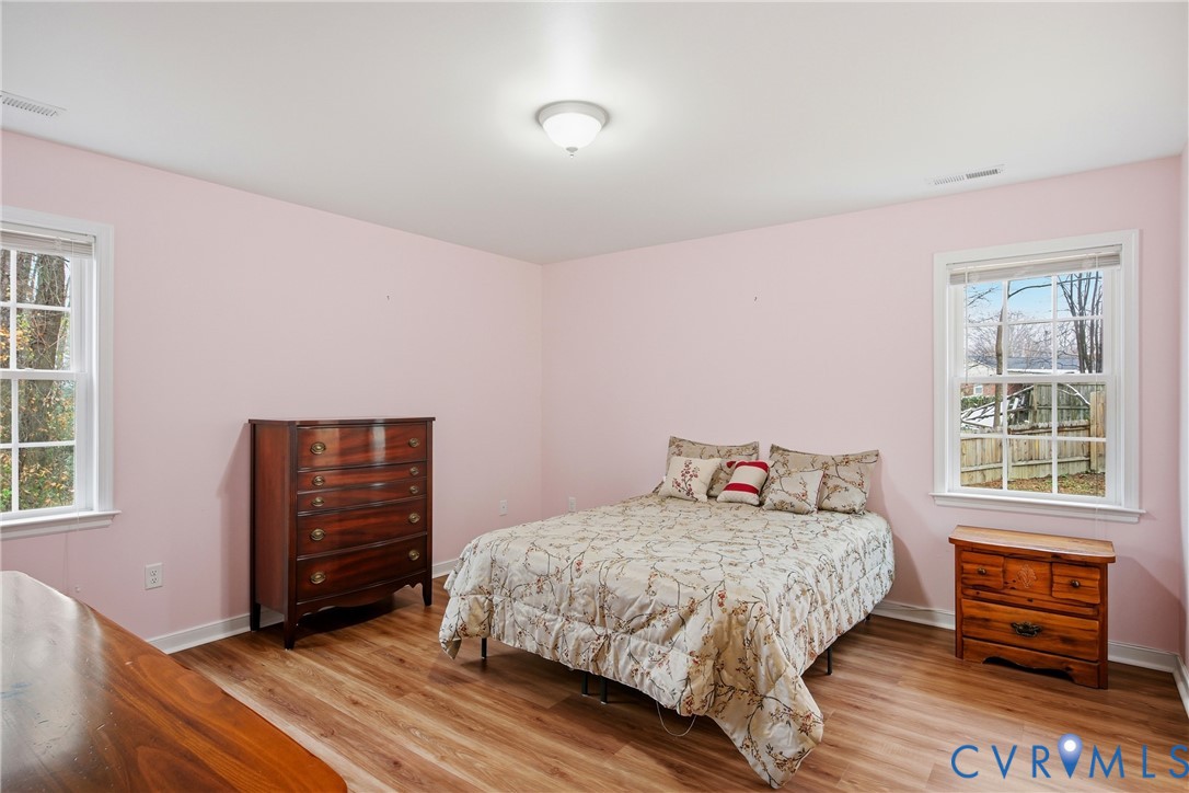 3007 Valleyfield Road Henrico, VA 23228 - Photo 18 of 38 a bedroom with a bed and wooden floor