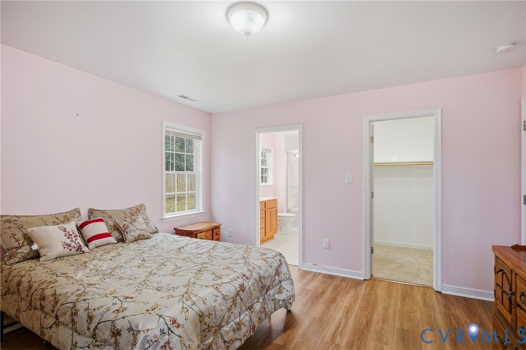 3007 Valleyfield Road Henrico, VA 23228 - Photo 19 of 38 a bedroom with a bed and wooden floor