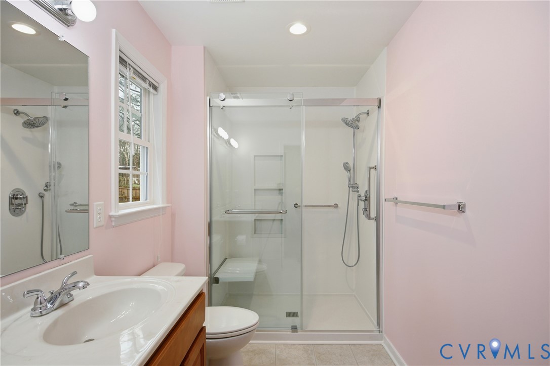 3007 Valleyfield Road Henrico, VA 23228 - Photo 21 of 38 a bathroom with a shower sink vanity mirror and toilet