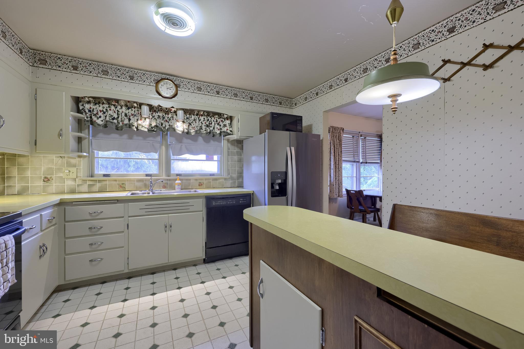 136 Springhouse Road Lancaster, PA 17603 - Photo 13 of 30 a kitchen with a sink stove and cabinets