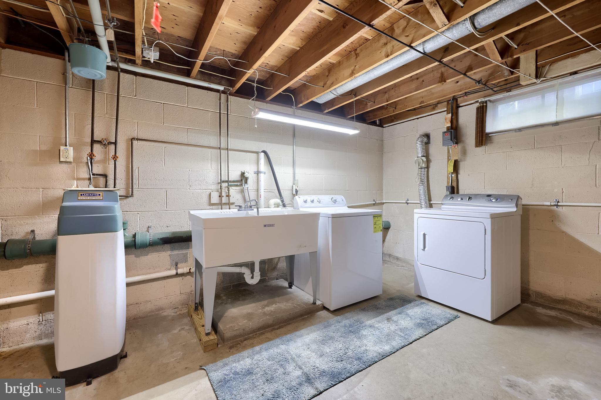 136 Springhouse Road Lancaster, PA 17603 - Photo 24 of 30 a utility room with a sink dryer and washer