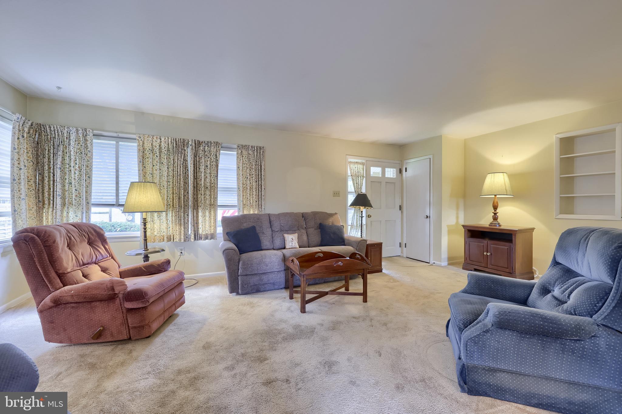 136 Springhouse Road Lancaster, PA 17603 - Photo 8 of 30 a living room with furniture and a lamp