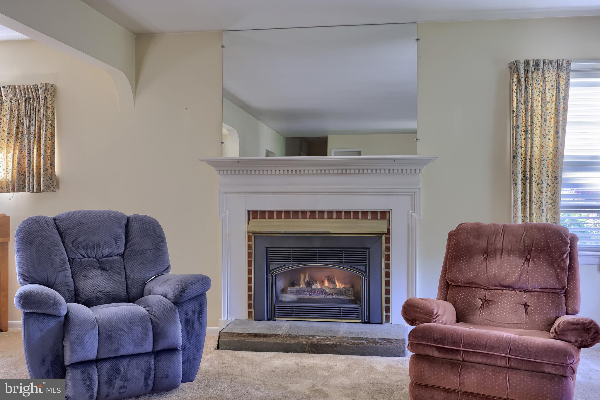 136 Springhouse Road Lancaster, PA 17603 - Photo 9 of 30 a living room with furniture couch and a fireplace
