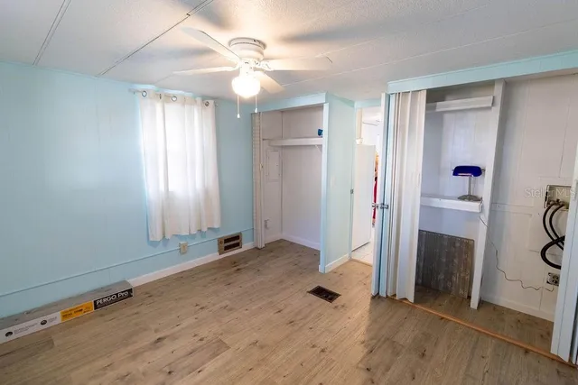 a view of an entryway with wooden floor