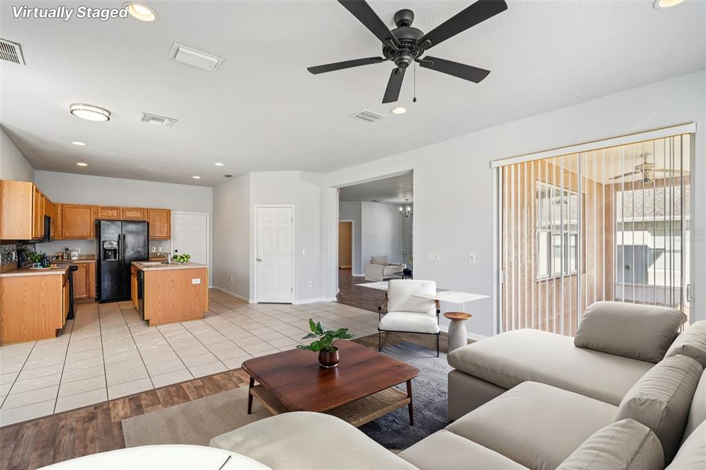 4127 Southwest 51st Court Ocala, FL 34474 - Photo 12 of 32 a living room with furniture and a large window