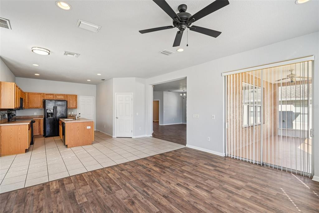 4127 Southwest 51st Court Ocala, FL 34474 - Photo 13 of 32 an empty room with wooden floor and windows