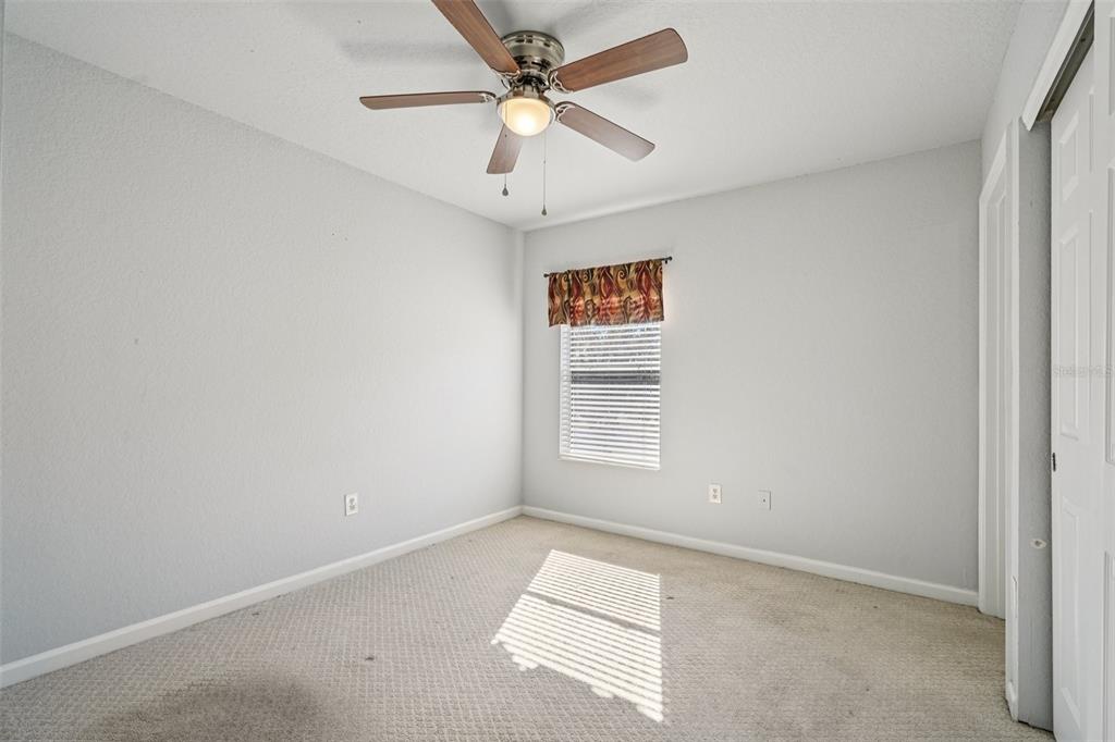 4127 Southwest 51st Court Ocala, FL 34474 - Photo 21 of 32 an empty room with a window and a fan