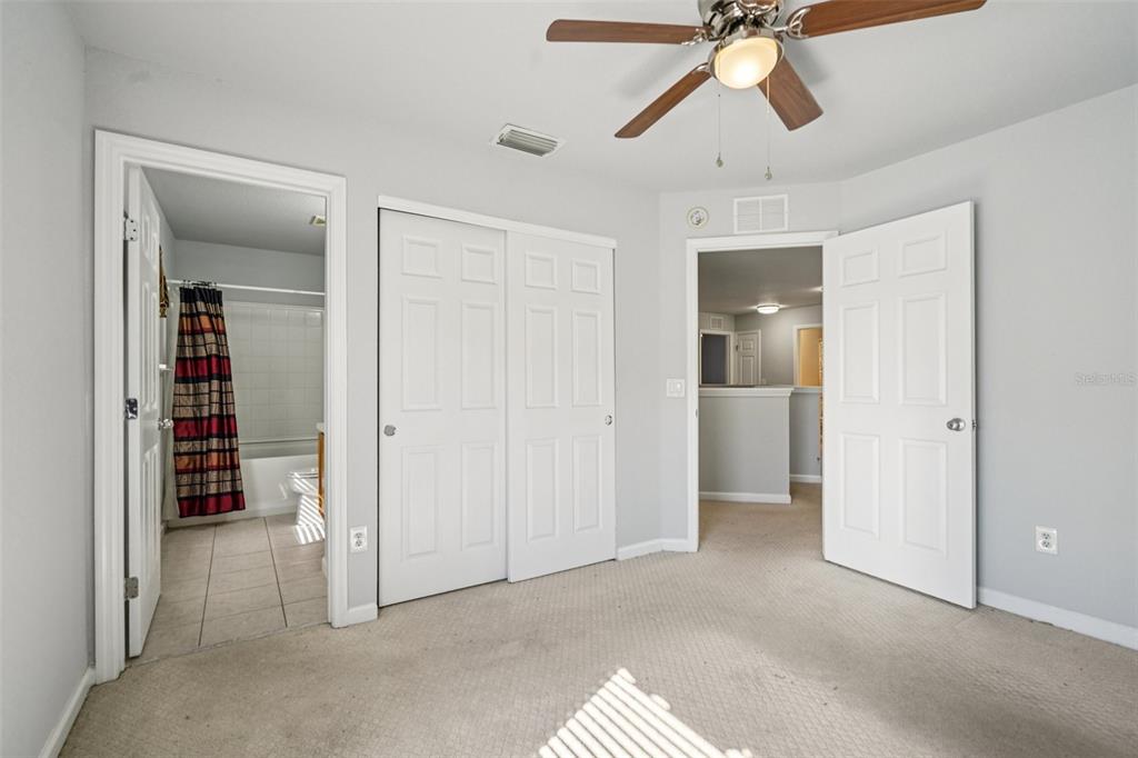 4127 Southwest 51st Court Ocala, FL 34474 - Photo 22 of 32 a view of empty room with wooden floor and ceiling fan