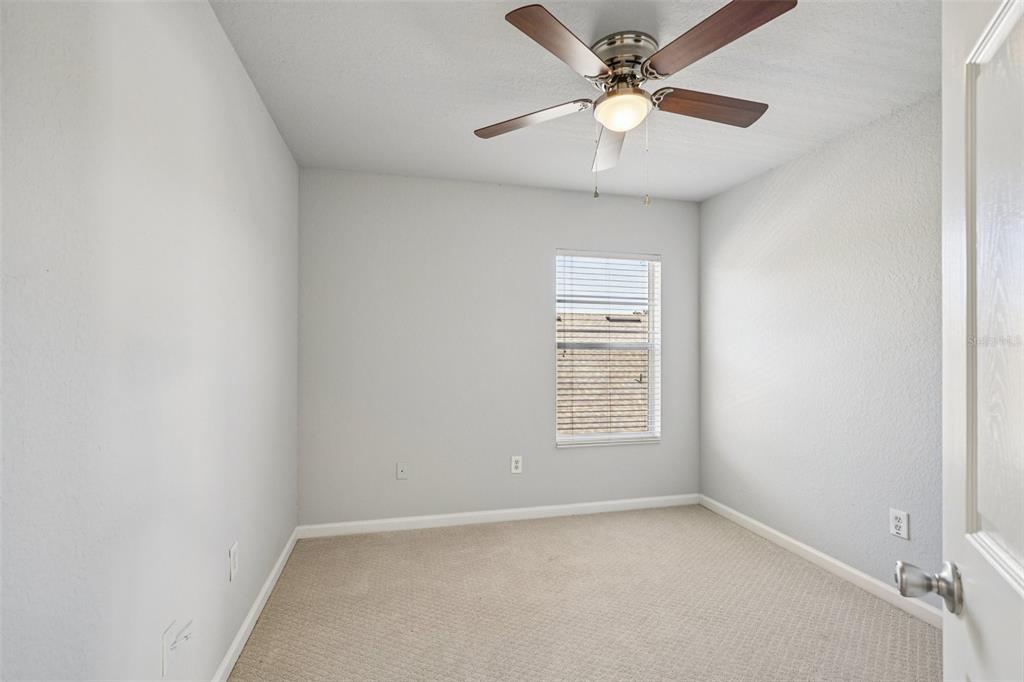 4127 Southwest 51st Court Ocala, FL 34474 - Photo 24 of 32 an empty room with a window and a fan