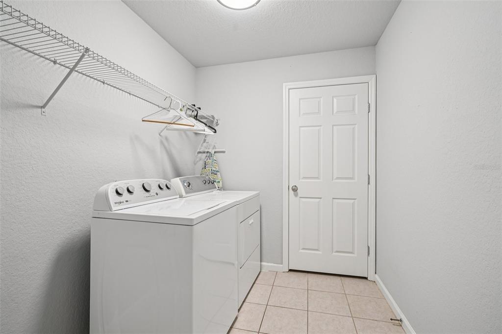 4127 Southwest 51st Court Ocala, FL 34474 - Photo 28 of 32 a utility room with dryer and washer