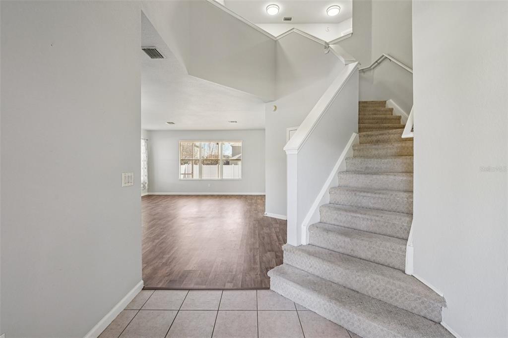 4127 Southwest 51st Court Ocala, FL 34474 - Photo 4 of 32 a view of entryway and hall with wooden floor