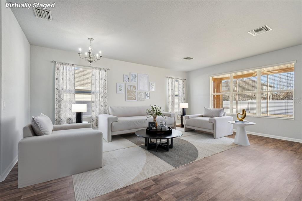 4127 Southwest 51st Court Ocala, FL 34474 - Photo 6 of 32 a living room with furniture and a large window