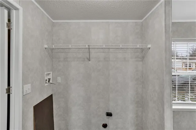 a bathroom with a shower and a sink