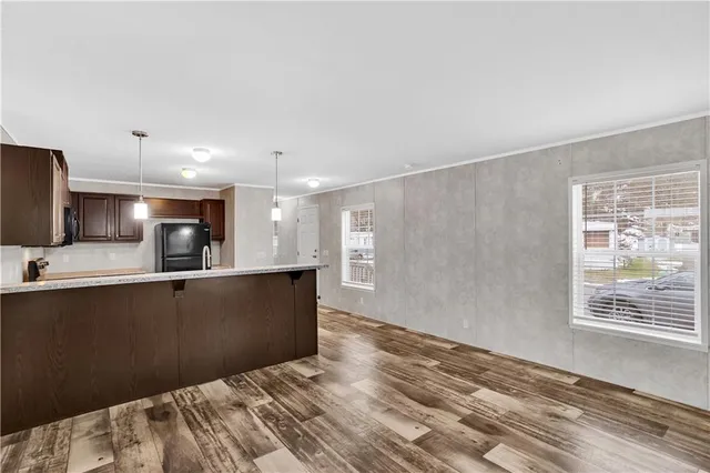 a view of kitchen and wooden floor