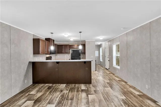 a view of kitchen and wooden floor