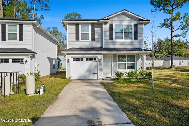 a front view of a house with a yard