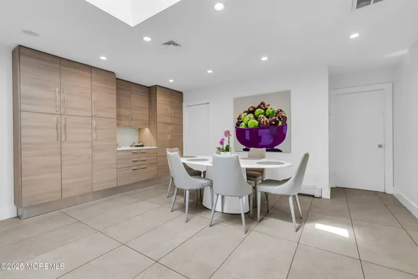 a kitchen with a dining table chairs and view kitchen