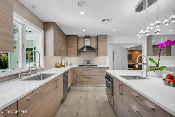 a kitchen that has a stove and a table