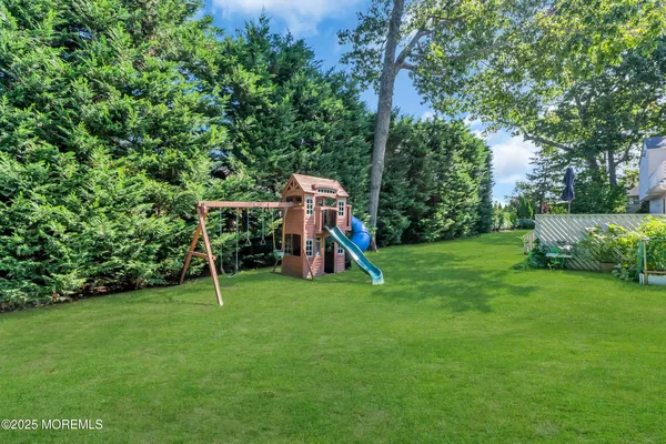 an aerial view of a house with a backyard
