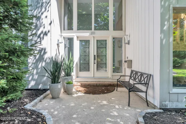 a view of outdoor space with porch and wooden floor
