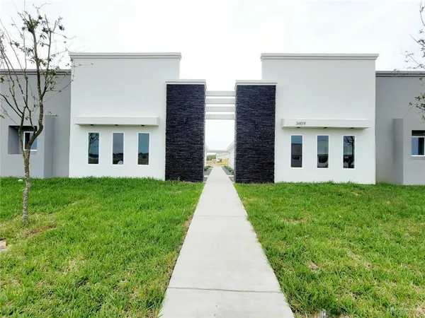 front view of a house with a yard