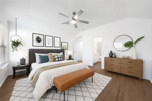 a bed room with a bed mirror and a window