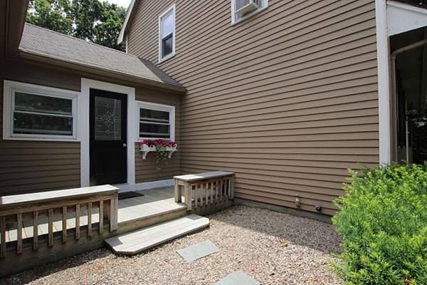 40 Old Farm Road North Attleboro, MA 02760 - Photo 13 of 36 a view of a patio with a table and chairs and wooden floor