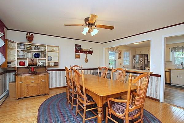 40 Old Farm Road North Attleboro, MA 02760 - Photo 14 of 36 a dining room with stainless steel appliances granite countertop a dining table and chairs with wooden floor